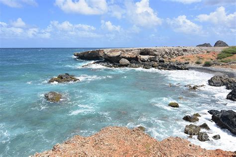Tropical Waters Off The Shore Of Arubas Black Stone Beach Photograph