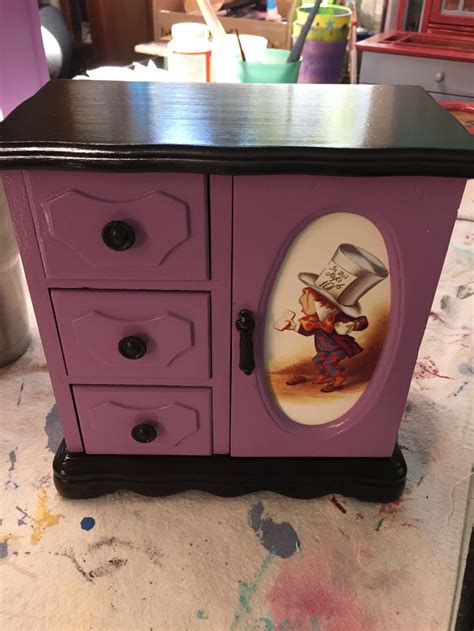A Purple Cabinet With An Image Of A Cartoon Character Painted On The