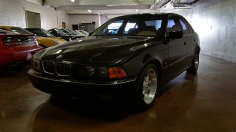 As long as it drives smoothly and you. 1 OWNER.. 1997 BMW 540i Sport, Black on Tan, 82k miles, 6 SPEED!! Pre Vanos