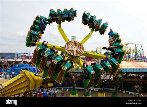 dragon s claw a ride that spins people upside down at adventure island in southend on sea stock