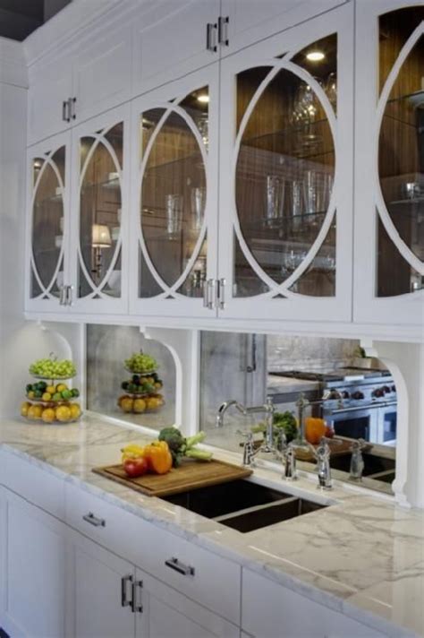 Maybe you would like to learn more about one of these? circle detail glass doors, mirror back-splash. | Kitchen ...