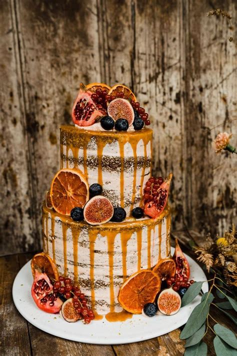Semi Naked Wedding Cake With Orange Drip And Fig Decor Autumn Wedding