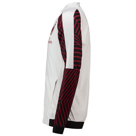 It features 2 pockets and is a lightweight construction with a team badge. Puma AC Milan Stadium Jacket - Puma White / Chili Pepper ...
