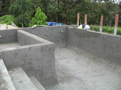 Gunite is a dry mix with water. Concrete Swimming Pool Construction Process