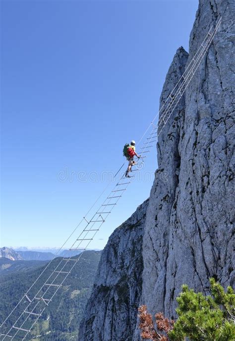 Einzigartige attraktion am donnerkogel klettersteig, auf der zwieselalm in gosau: Man Climbing On A Via Ferrata Near A Waterfall Editorial Image - Image of near, sport: 50327755