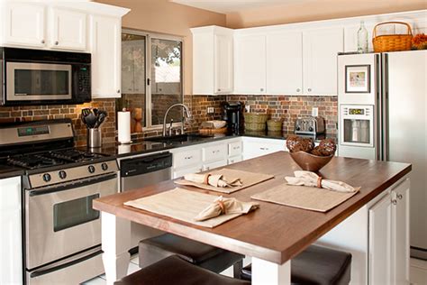 The kitchen backsplash has a retro vibe with its checkerboard pattern and is neutralized with all white paneled cabinets and stainless steel appliances. Elements of Transitional Kitchen Style | Orson Klender ...
