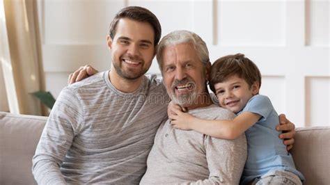 Three Generations Of Men Relax At Home Together Stock Photo Image Of