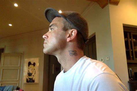 Robbie williams' 22 tattoos & their meanings. Robbie Williams tattoo: Meanings behind X Factor judge's ...