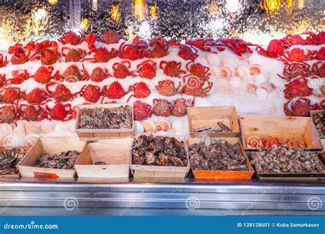 Outdoor Fish Market With Crab And Shrimp On Ice Paris France Stock