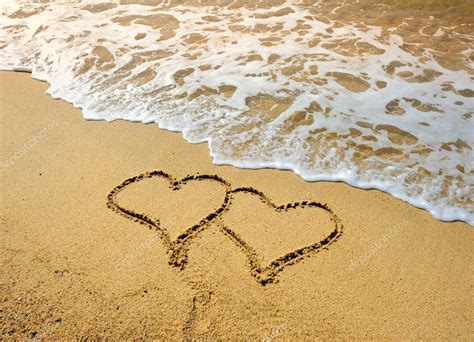 Two Hearts Drawn In Beach In Sunset — Stock Photo © Firefox 6552416