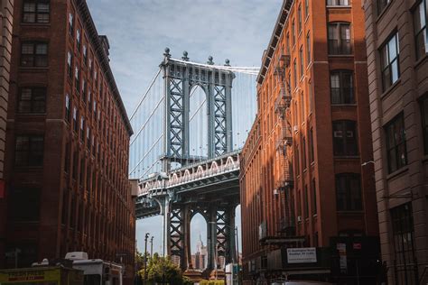 Manhattan Bridge Seen Between Buildings · Free Stock Photo