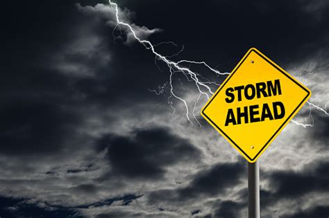 Storm Ahead Warning Sign In Thunderous Background Stock Photo