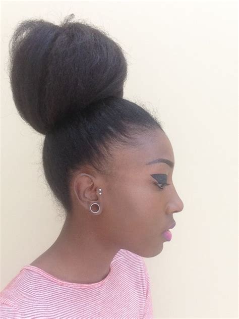an easy to style natural hair bun using braiding hair for black women afro hairstyles