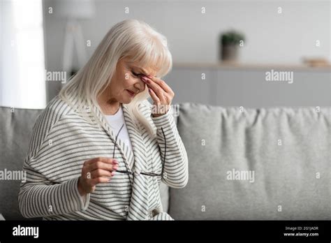 Tired Mature Woman Rubbing Dry Irritated Eyes Stock Photo Alamy