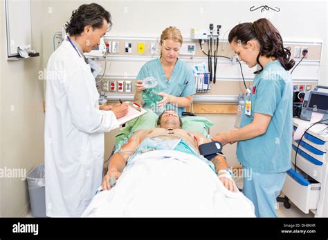 Doctor And Nurses Treating Critical Patient Stock Photo 62337375 Alamy