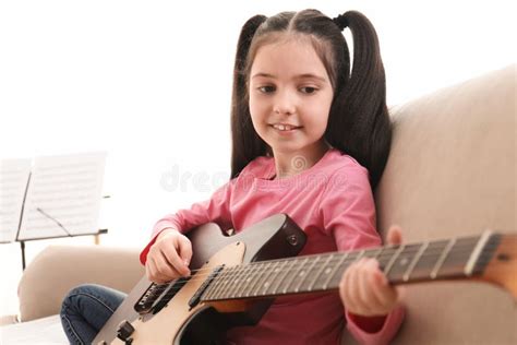 Little Girl Playing Guitar Learning Music Notes Stock Image Image Of