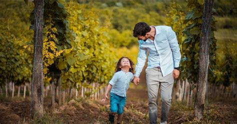 father and son walk through the vineyard photo nature image on unsplash