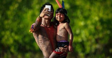 The Chief Of The Amazonian Indians Of Marubo Tribe And His Son Marubo