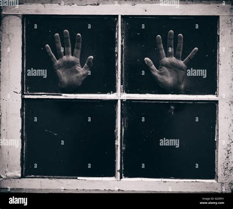 Palms Of Hands Pressed Against Window Panes Stock Photo Alamy