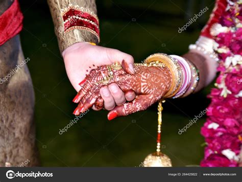 Bride And Groom Hand Together In Indian Wedding Stock Photo By