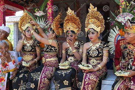 Young Balinese Women And A Man Decorated Due To The Potong Gigi