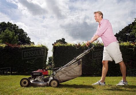 Man With Push Lawnmower Stock Photo Dissolve