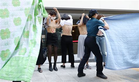 Korean Feminist Group Goes Topless In Protest Against Facebook