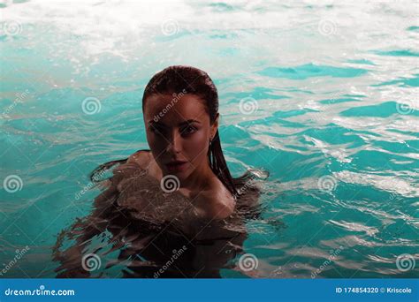 Beautiful Young Woman Swimming In The Pool Portrait Stock Photo