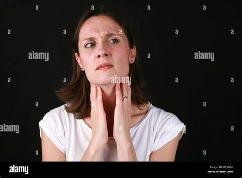 Young Woman Holding Neck Throat Suffering From Sore Throat And Swollen