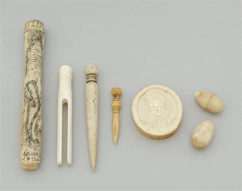 Lot Seven Carved Ivory Or Bone Items A Walrus Tusk Slab Carved On