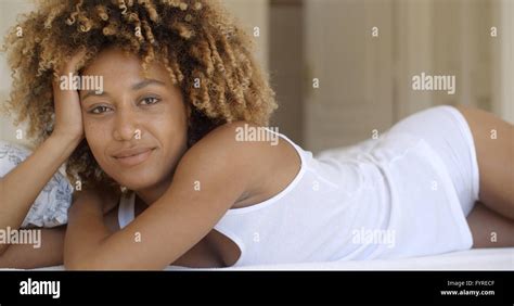 Beautiful African American Woman Lying On Bed Stock Photo Alamy