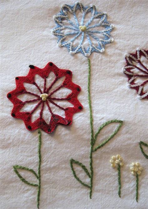 Use a pattern to transfer the image of a flower this style of embroidery features fine, delicate details spread evenly on a piece of fabric. The Handmade Flower: Embroidery Flowers