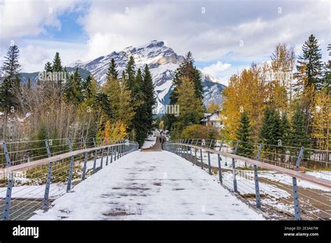 Banff Pedestrian Bridge And Bow River Trail In Snowy Autumn Day Banff