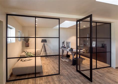 crittall style fixed glass partitions with a pivot door in the middle glass wall office glass