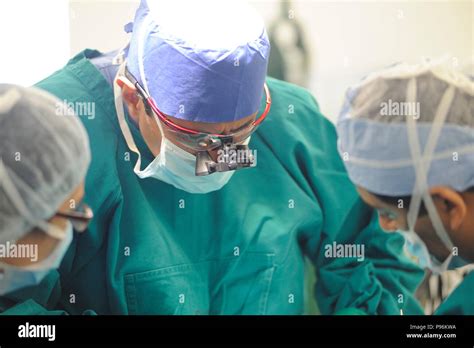 Concentrating Surgeons Performing Operation Stock Photo Alamy