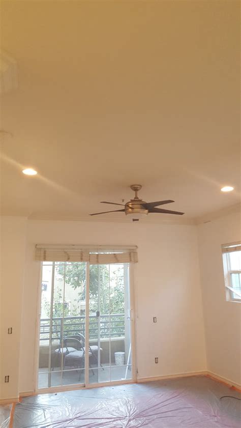 White and black and blue all over. white walls and crown molding