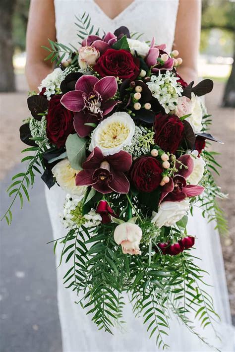 A Modern Black Tie Wedding With Burgundy Bouquets