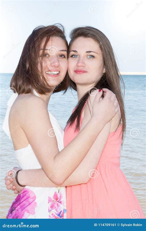 Lifestyle Fashion Portrait Of Two Pretty Fresh Young Lesbian Best