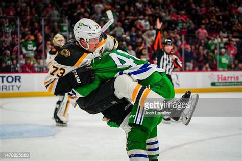 Charlie Mcavoy Of The Boston Bruins Fights Jordan Martinook Of The