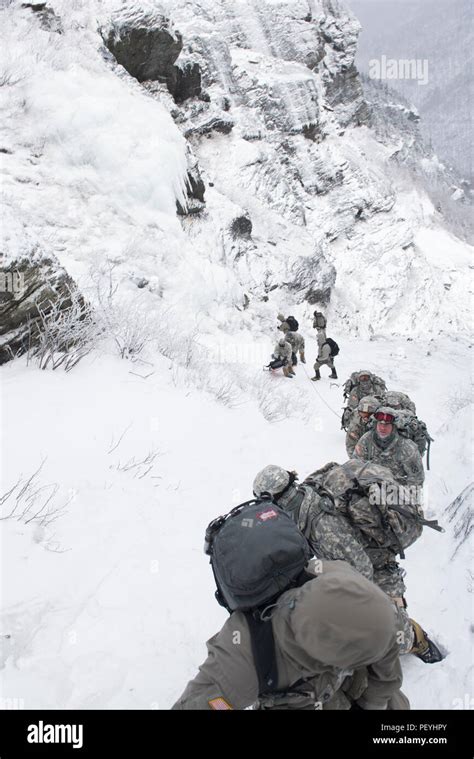 Us Army Soldiers In The Mountain Warfare Basic Course Climb The