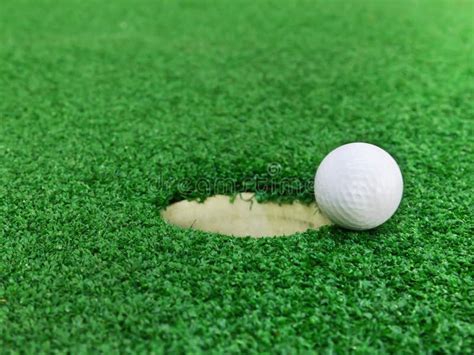 Golf Ball Near The Hole Stock Photo Image Of Action 24565630