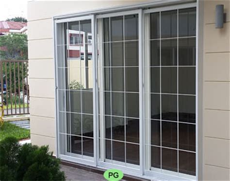 Double sliding patio door with prairie style internal grill. Wrought Iron Swing, Sliding and Folding Door Gates