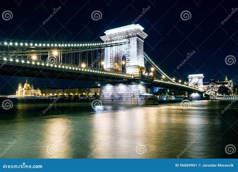 Chain Bridge And Hungarian Parliament Building At Night In Budapest