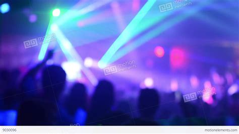 People Dancing At A Party Disco Stage Lights Blurred Shot Stock