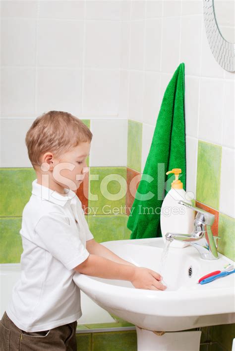 Little Boy Washes In A Bathroom Stock Photo Royalty Free Freeimages