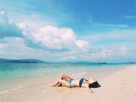 Beautiful Woman In Bikini Laying On The Paradise Beach Stock Photo