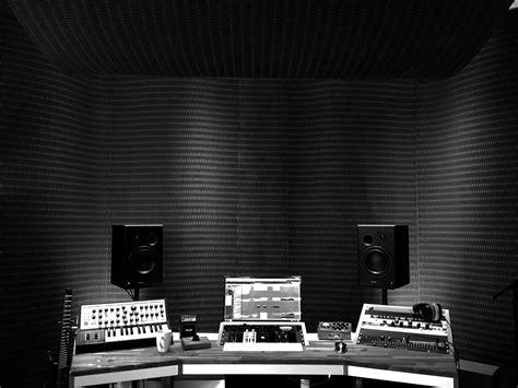 Recording studio walls covered with black MDF acoustic panels from