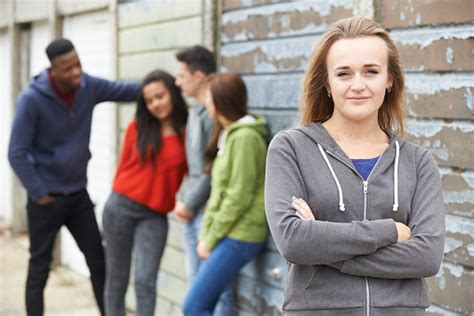 Premium stock photo of group of friends hanging out. Group Of Teenage Friends Hanging Out In Urban Setting ...