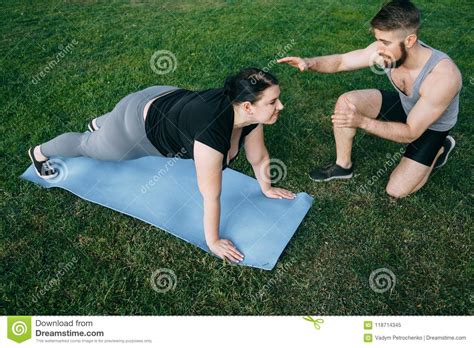 Obese Woman Doing Exercise With Instructor Support Stock Image Image
