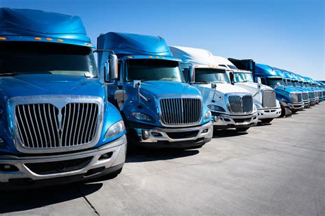 Fleet Of Blue 18 Wheeler Semi Trucks Stock Photo Download Image Now